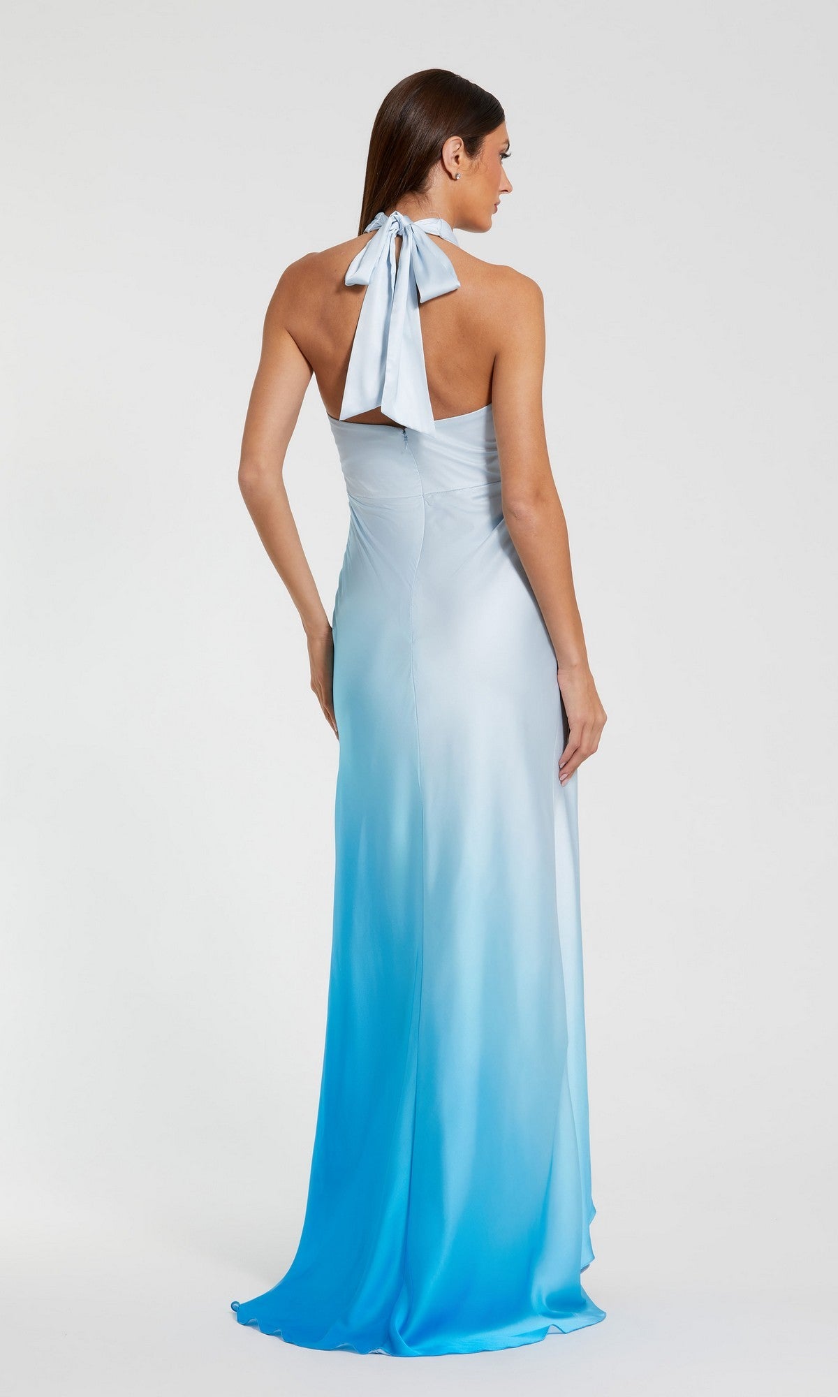 A woman models the Mac Duggal 68501 long formal dress—a blue ombre charmeuse evening gown with a halter sweetheart neckline—photographed from the back against a plain white background.